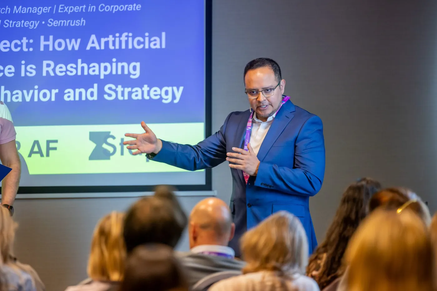 Fernando Angulo speaking on stage to an engaged conference audience